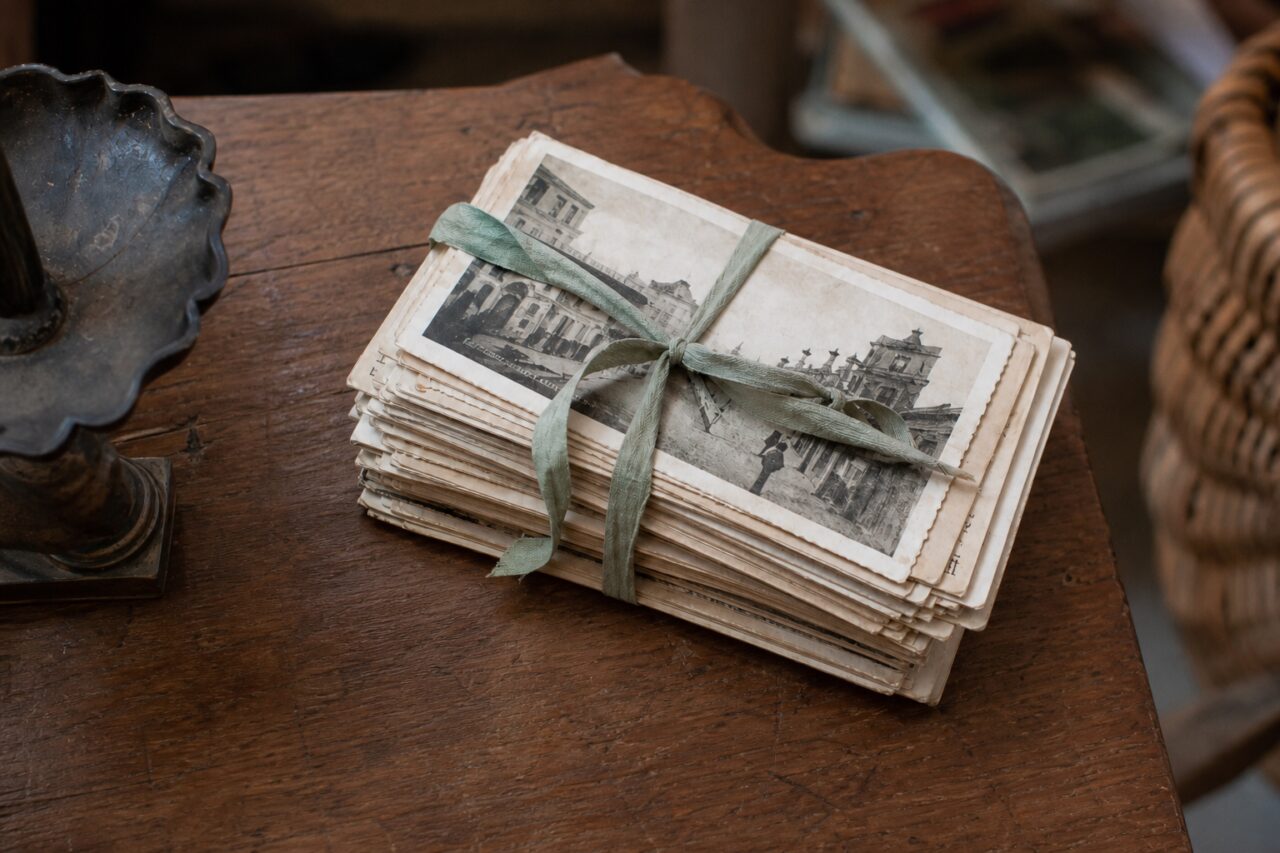 Old postcards seen from slightly above with their ribbon