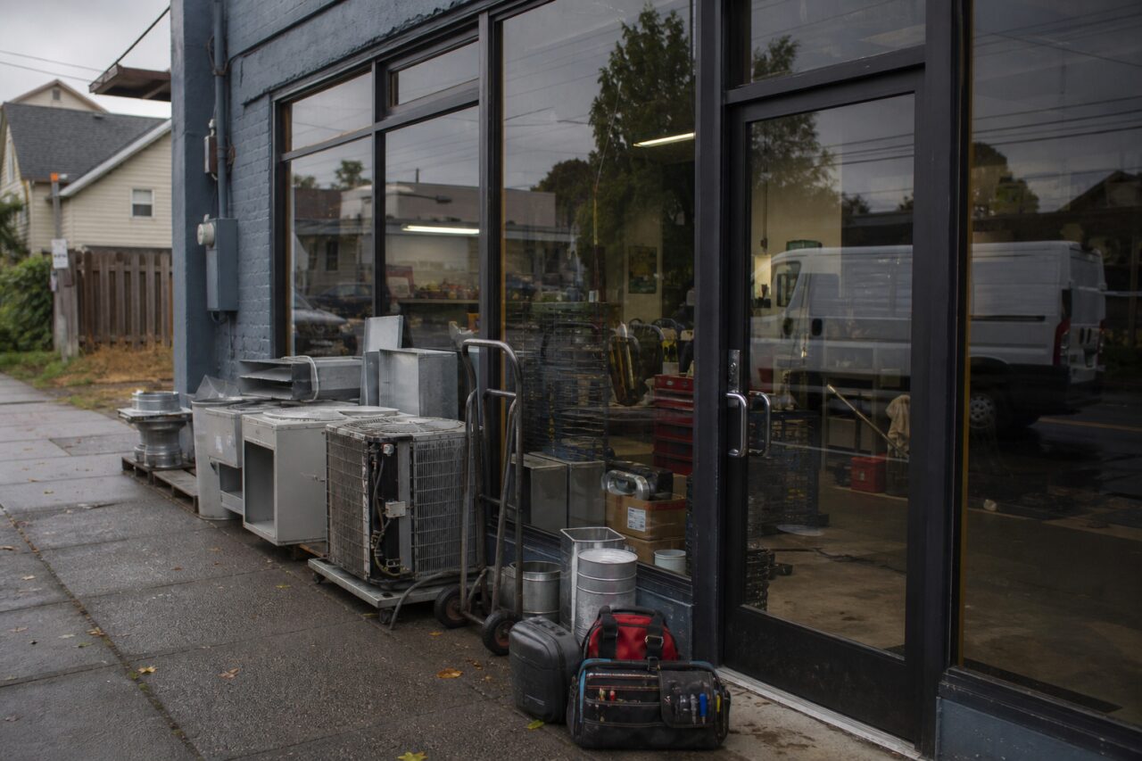 Glazed HVAC workshop frontage with outdoor units in Portland