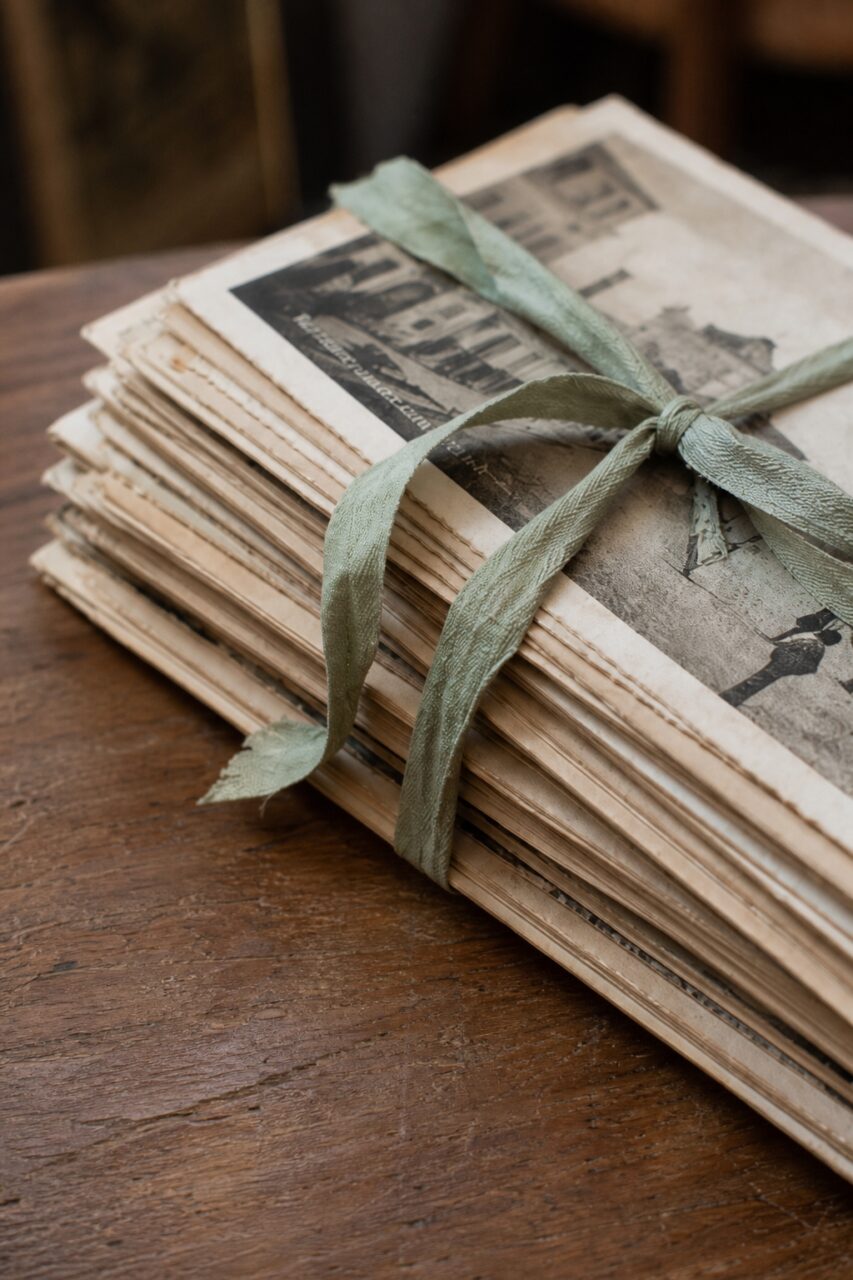 Close detail of an old postcard bundle and its tied ribbon