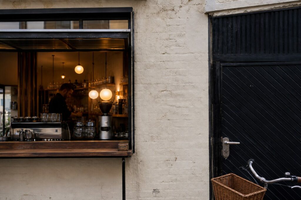 Espresso machine and grinder in a lit service window