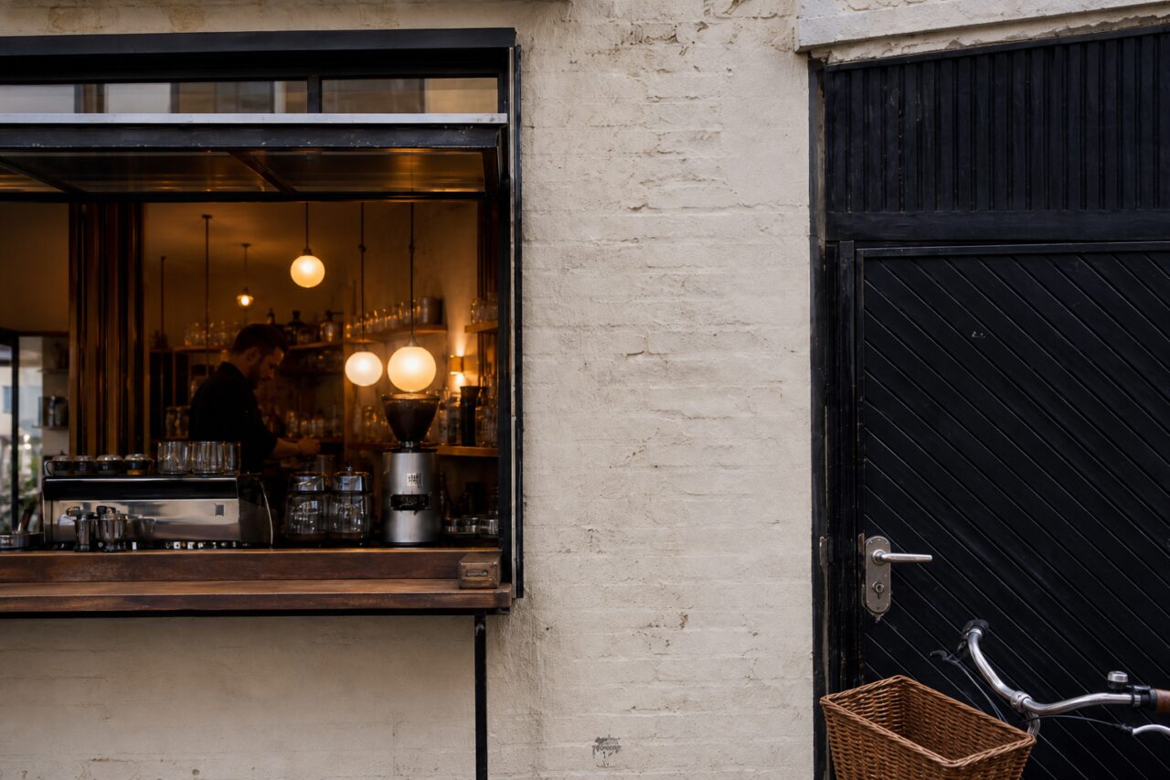 Espresso machine and grinder in a lit service window