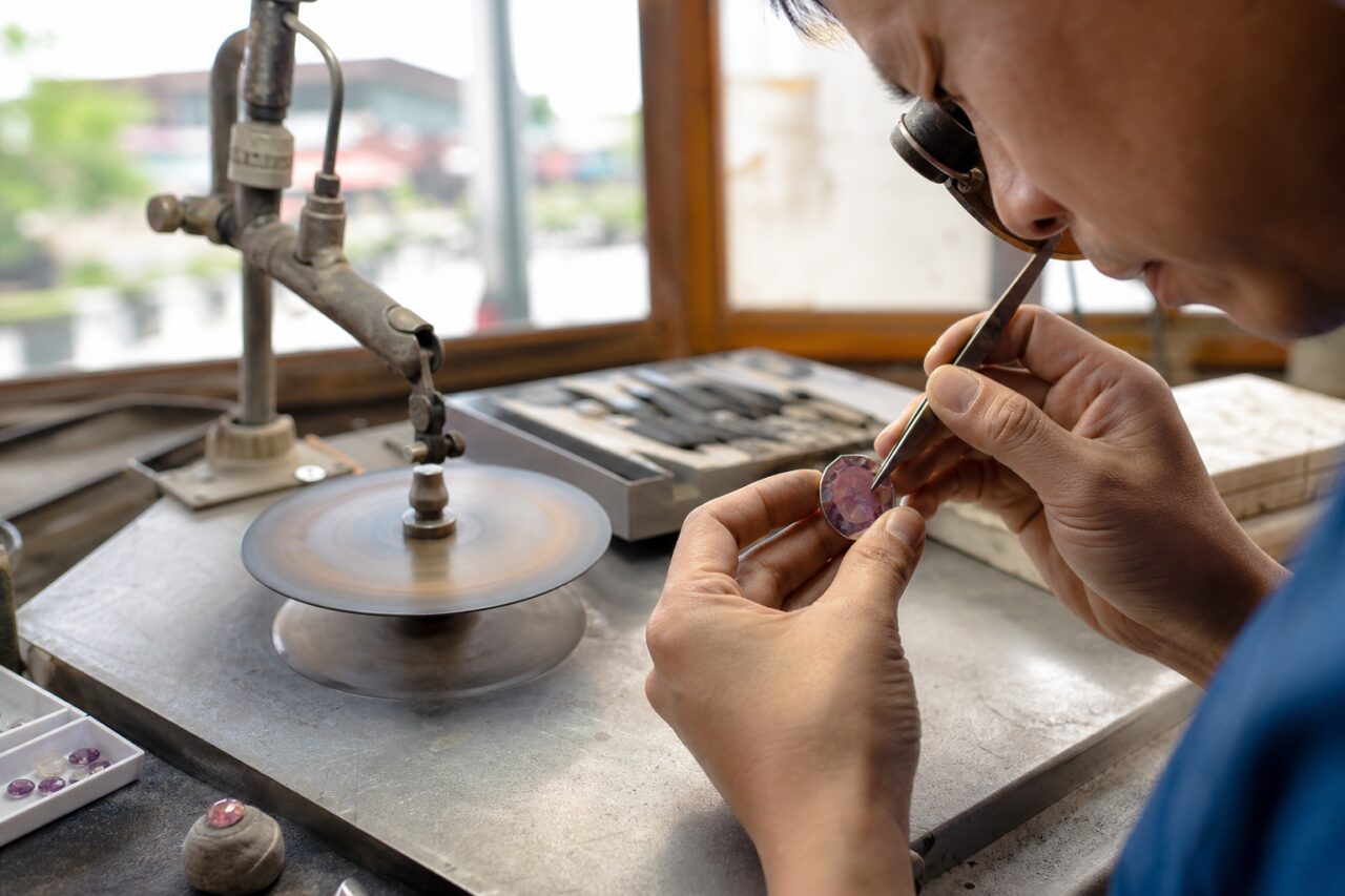 Examining a round object with violet facets