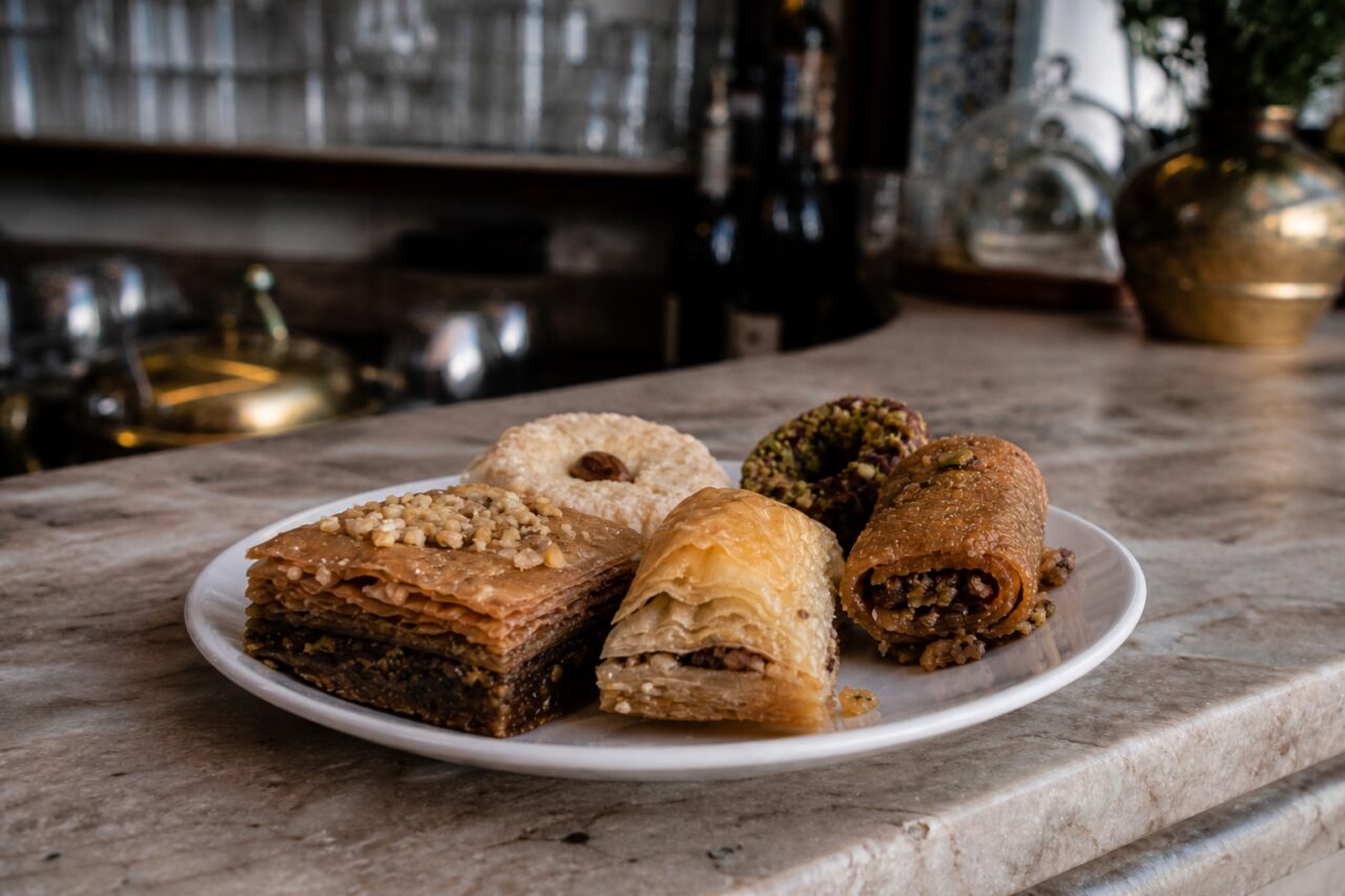 Layered pastries seen from the side on a plate