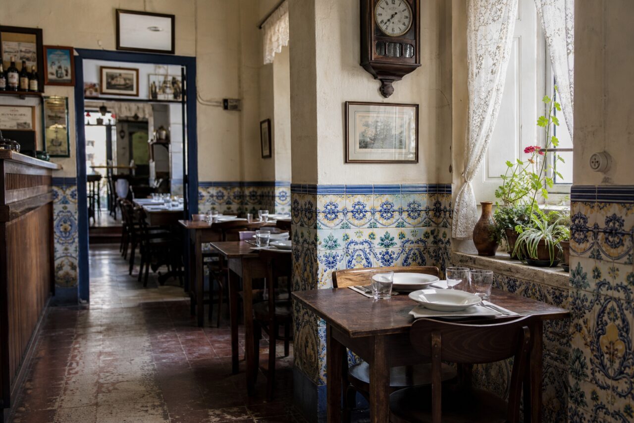 Dining room with patterned tiles and a set table