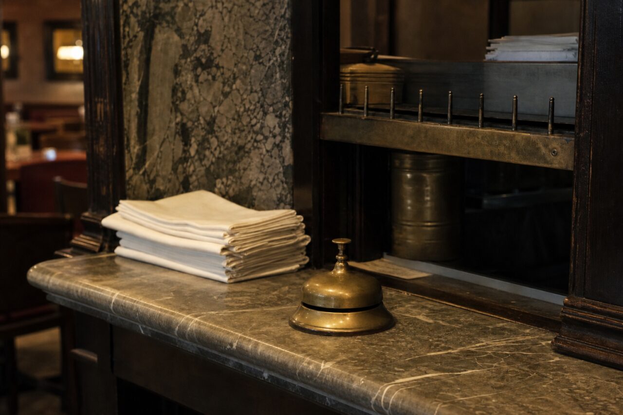 Bell to the right of napkins before the service recesses