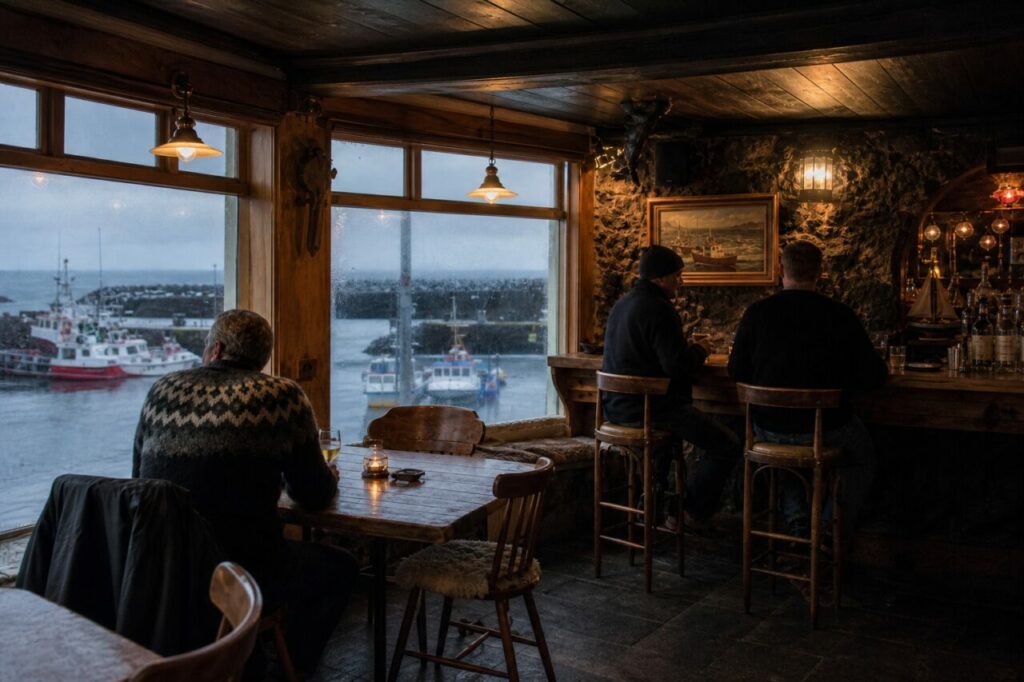 Tafel bij de ramen en gasten aan de bar
